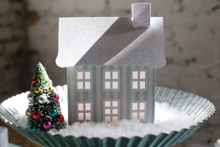 Snow and beaded bottle brush with blue pop-up holiday village house